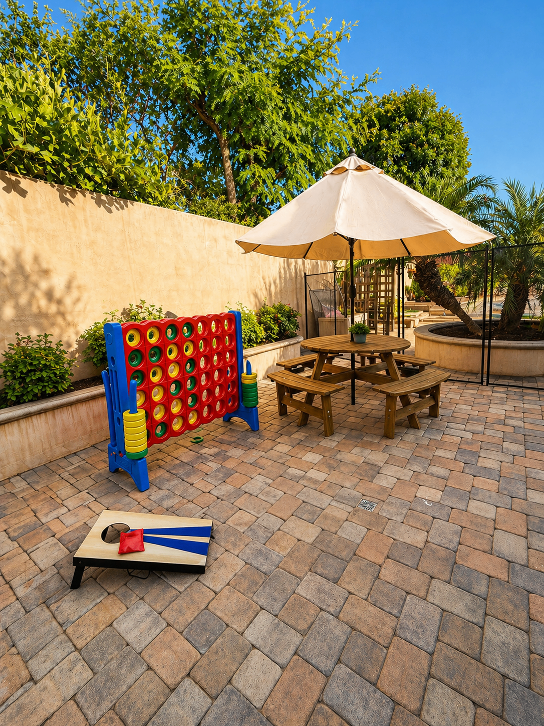 Outdoor games and shaded table area in the backyard