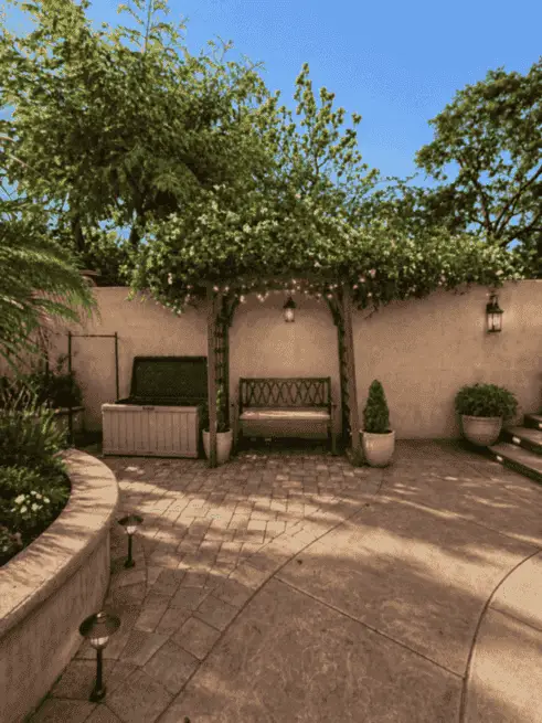 Pergola seating area in the backyard during the day