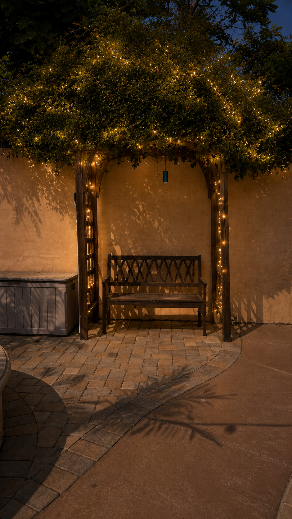 Pergola bench with string lighting in the evening