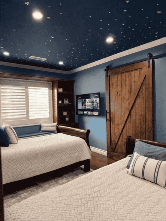 Bedroom with two beds and a star-patterned ceiling