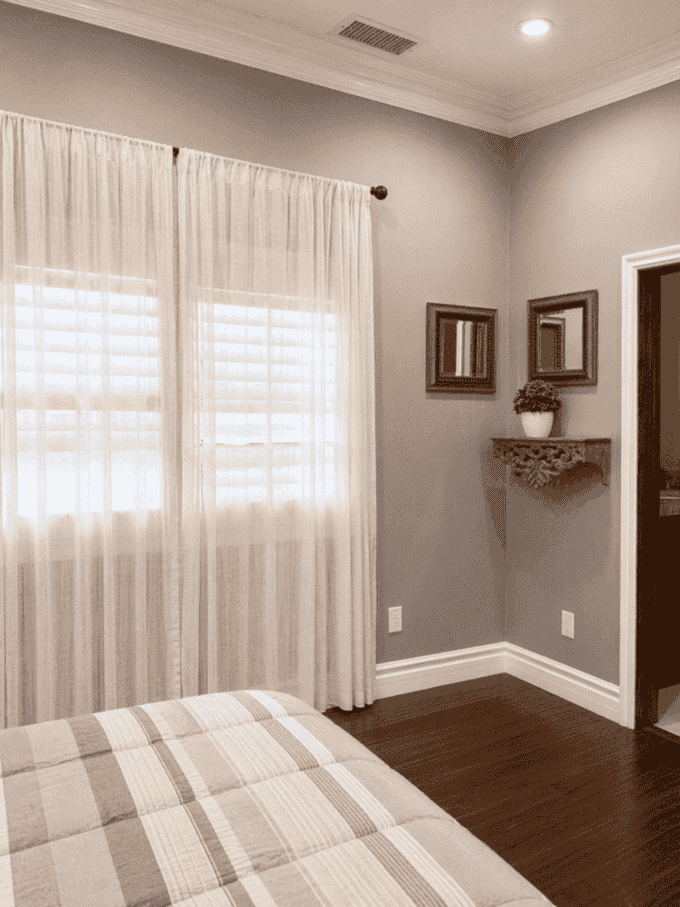 Bedroom with window seating and soft natural light