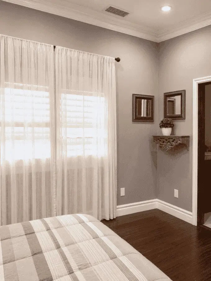 Bedroom with window seating and soft natural light