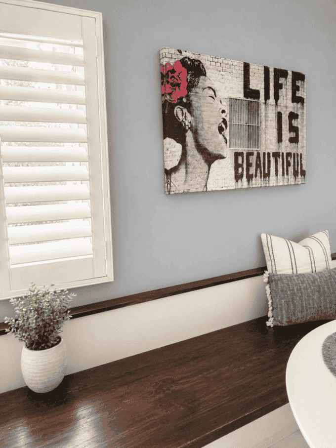 Built-in wood bench seating beside dining area
