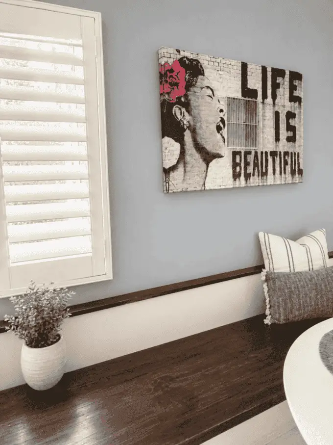Built-in wood bench seating beside dining area