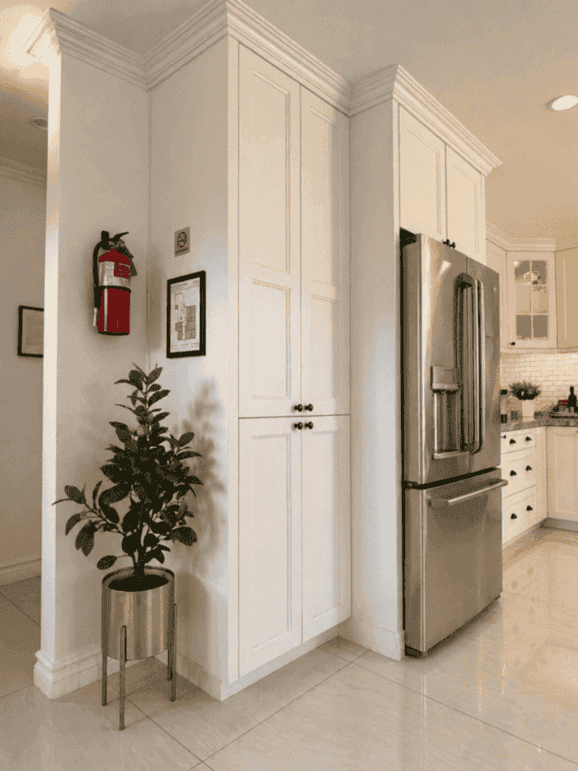 Kitchen pantry and refrigerator area