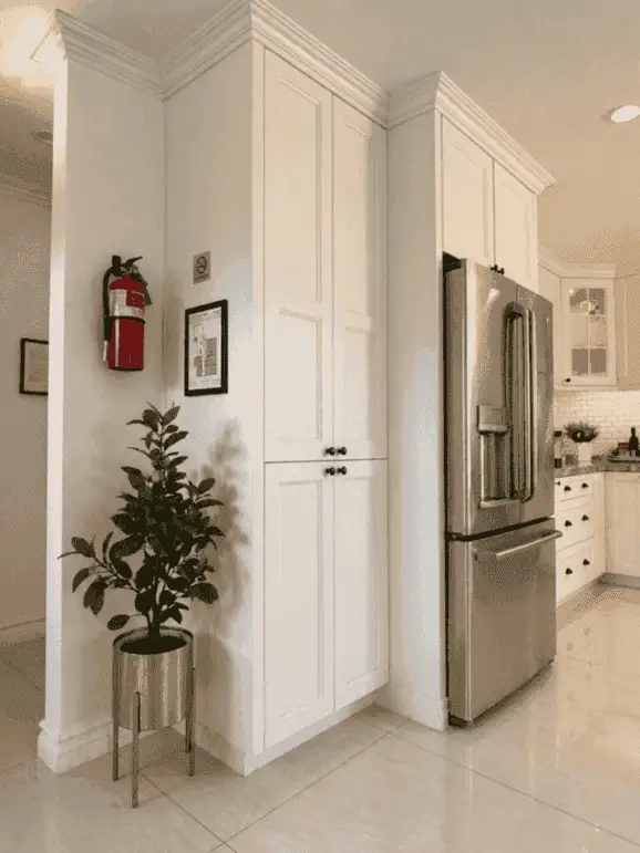 Kitchen pantry and refrigerator area