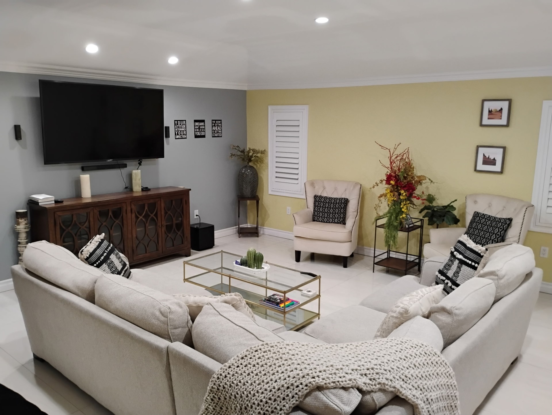 Main living room with sectional seating and large screen