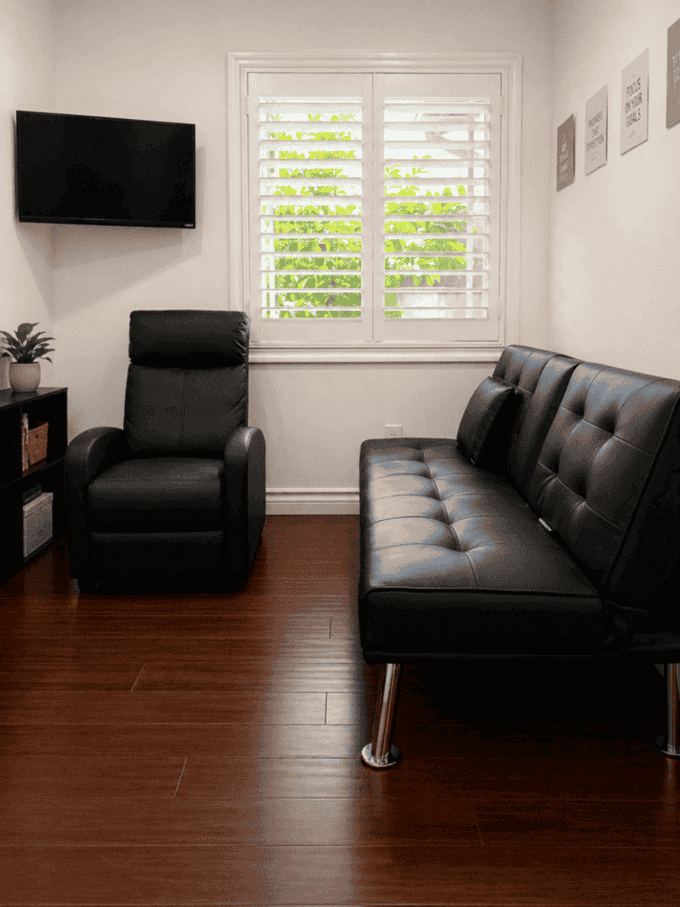 Therapy lounge with recliner, futon, and natural light